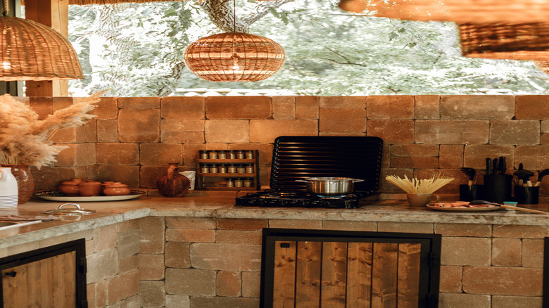 kitchen with wicker pendant lighting