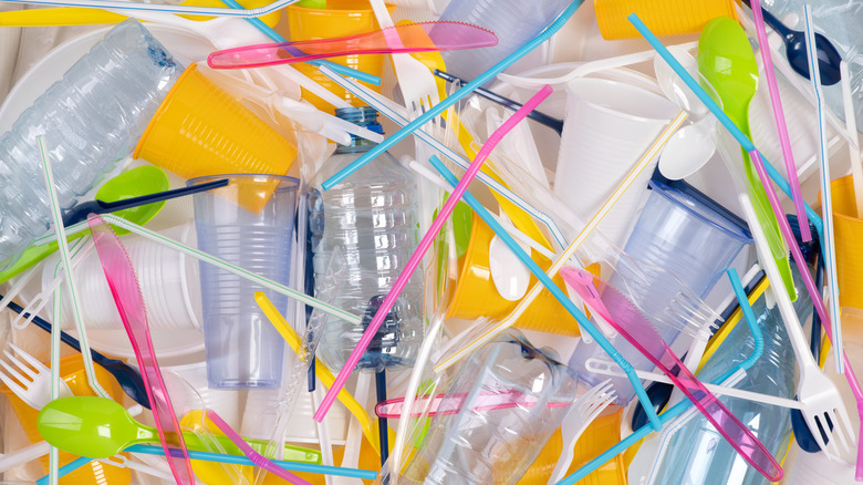 Single-use plastic bottles, cups, straws, and utensils