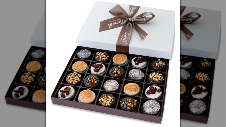 Brown and white box of Barnetts Easter Cookies with chocolate coatings and toppings including nuts and rainbow chips