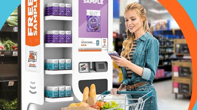 Woman using a Freeosk machine while shopping in a grocery store