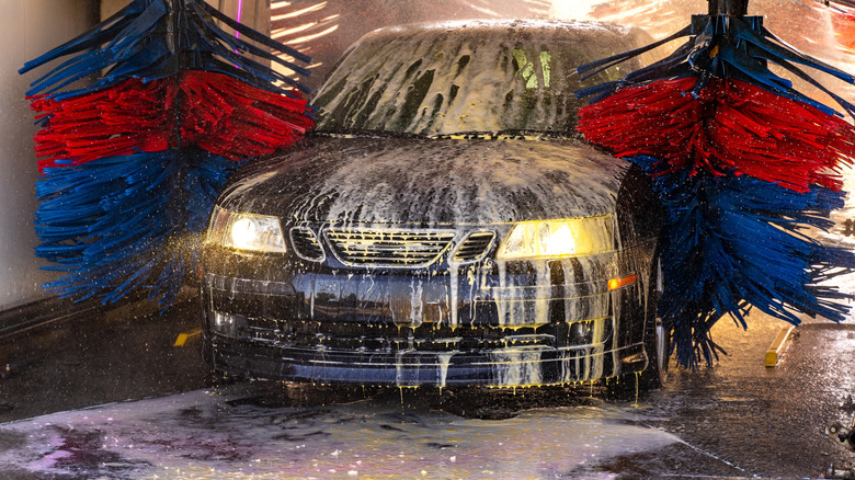 Car being washed inside a simple car wash