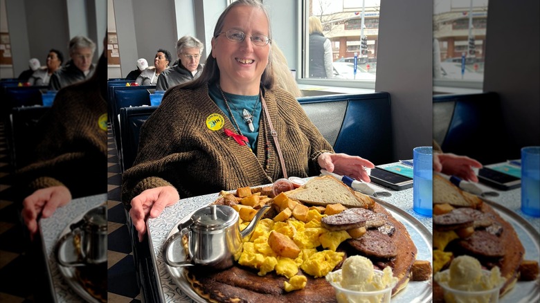 Customer sitting in a booth with the Barbarian Breakfast