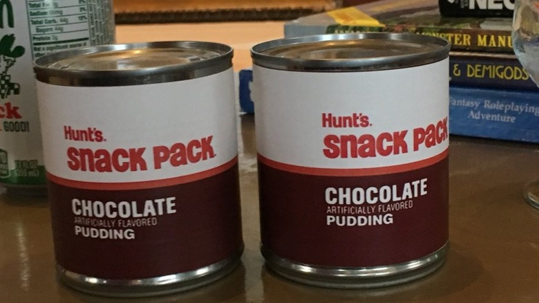 Two Hunt's chocolate pudding Snack Packs in tin cans