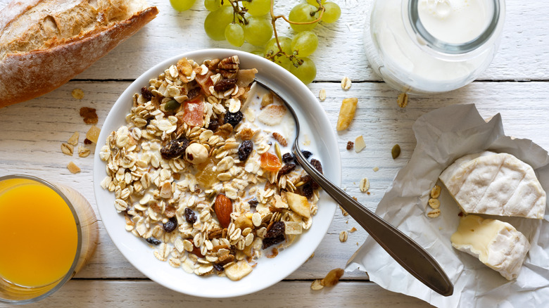 A bowl of müesli featuring dried fruit and nuts