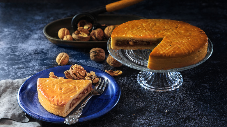 A slice taken from a Bündner nusstorte, a sweet walnut pastry
