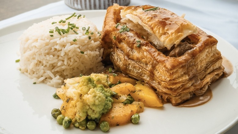Luzerner chügelipastete, a vol-au-vent, served with rice and vegetables