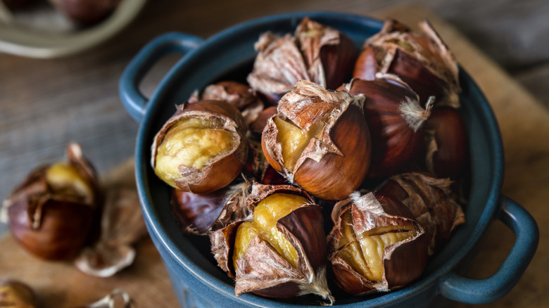 Roasted chestnuts in a blue pot
