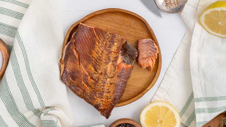 Top view of fillet of kippered salmon on wooden plate