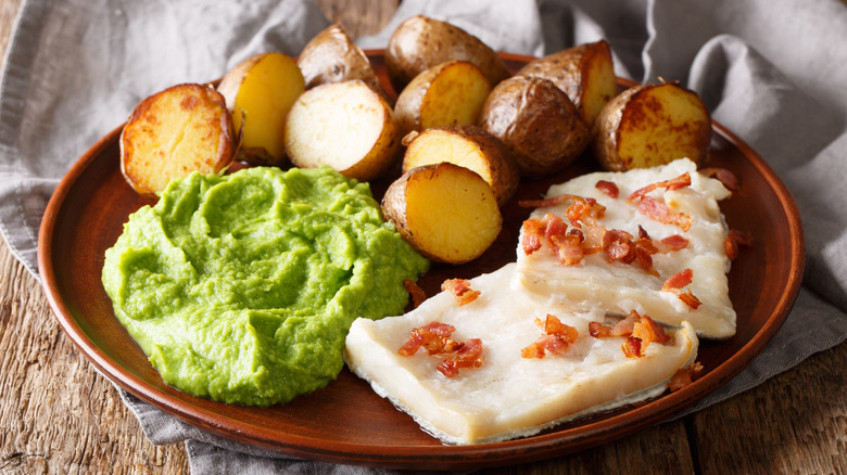 Lutefisk served with potatoes and smashed peas