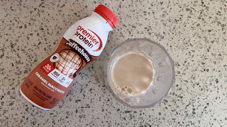 Coffeehouse Caramel Macchiato bottle with a glass cup