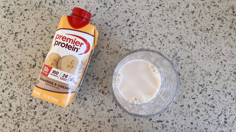 Bananas & Cream bottle and a glass cup