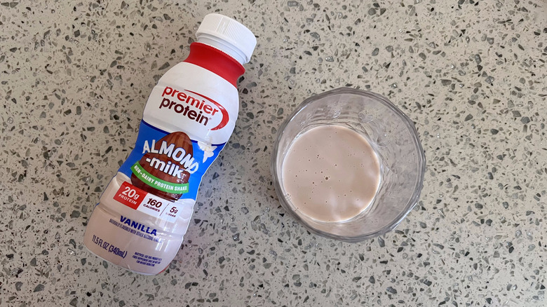 Almond Milk Vanilla bottle and a glass cup