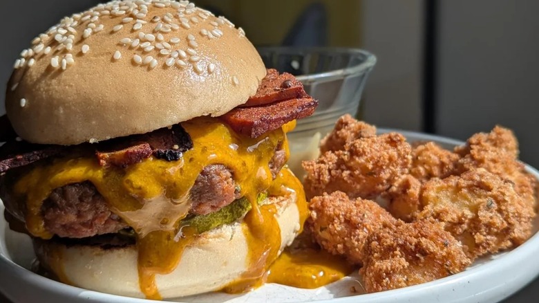 Bratburger withmustard and side of fried cheese curds