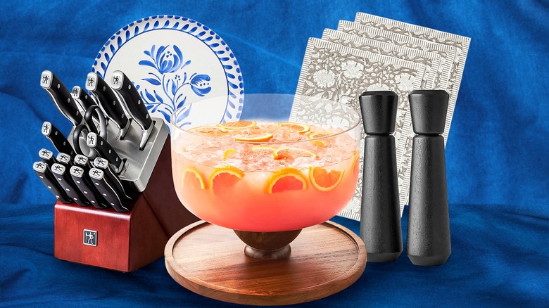 Knives, plates, a punch bowl, salt and pepper shakers, and placemats