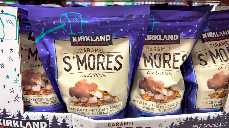 Purple packages of Kirkland Signature Caramel S'mores Clusters on the store shelf