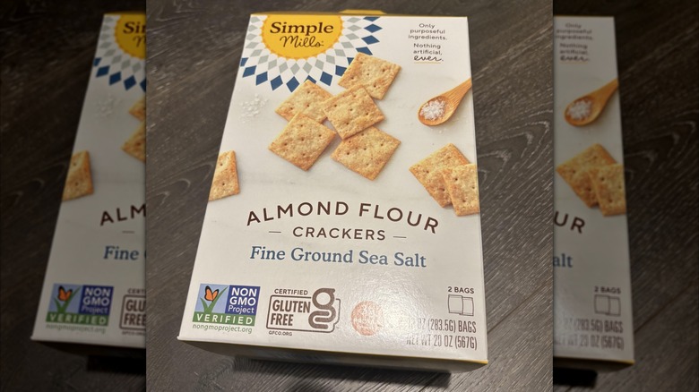 A box of Almond Flour Crackers lying on a wooden surface