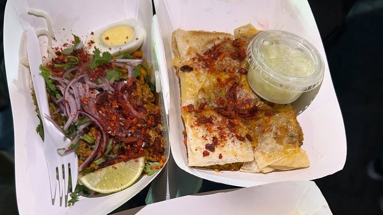 Two trays of food at Queens Night Market