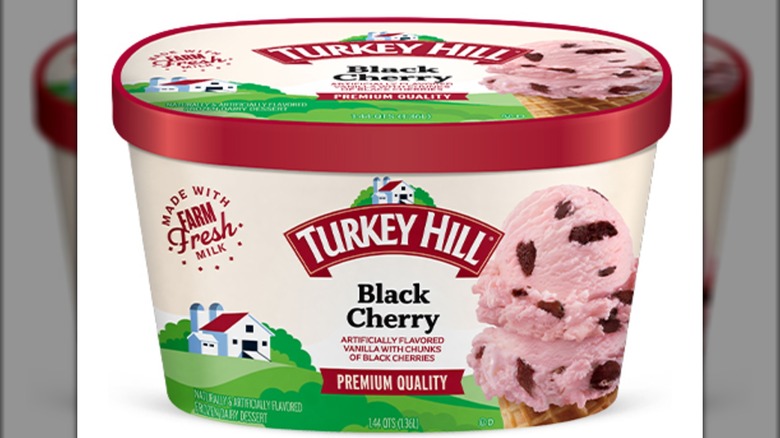 Red and cream colored container of black cherry ice cream