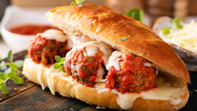 Meatballs on toasted bun with interior melted cheese layer