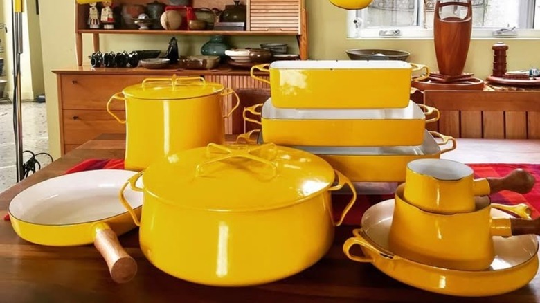 Yellow Dansk Købenstyle cookware set on a wooden table