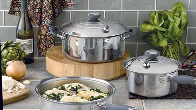 Vintage Royal Prestige cookware set of three in kitchen