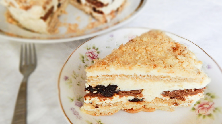 A slice of chocolate and vanilla icebox cake on an old-fashioned plate