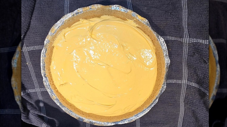 A homemade tang pie on striped navy cloth