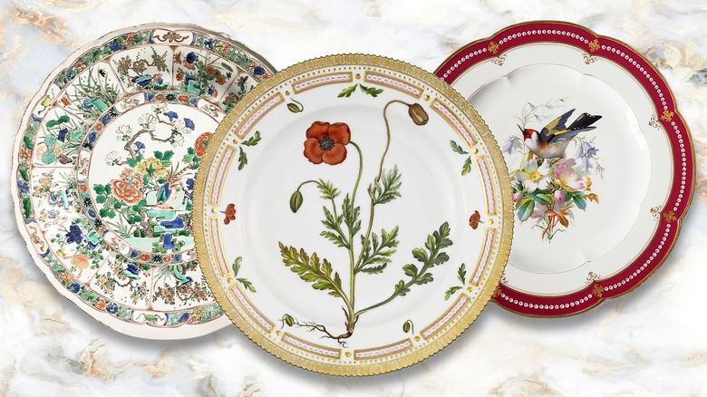 Three vintage plates on a marble countertop