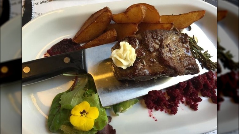 Steak served on a knife