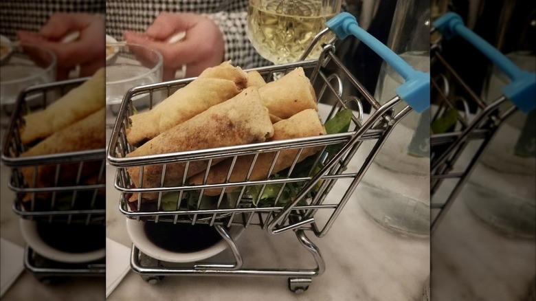 Duck rolls plated in mini cart