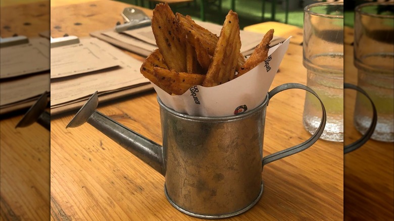 Fries served in a watering can