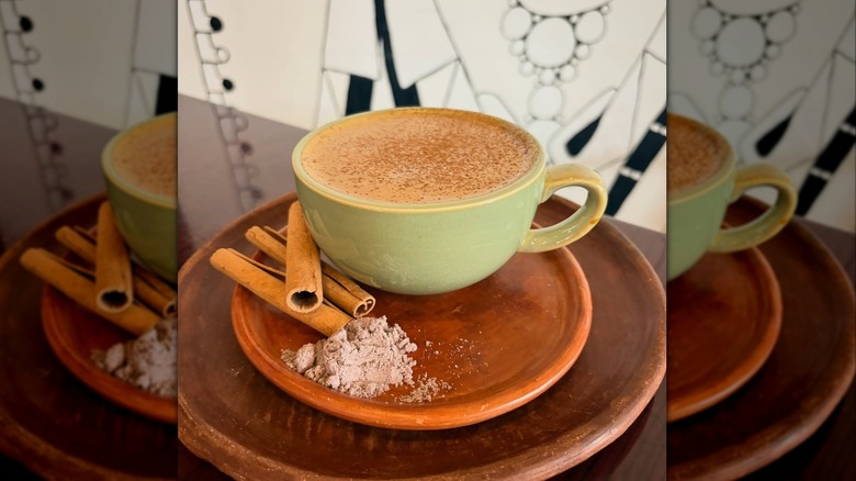 A coffee cup with sugar and cinnamon
