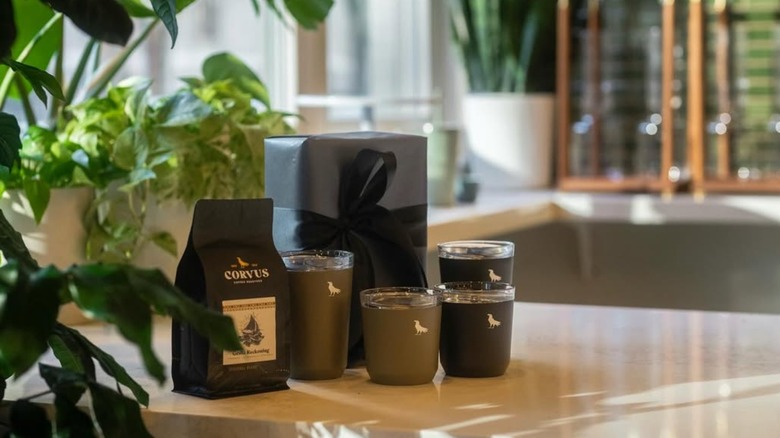 Cups and a bag of coffee on a countertop