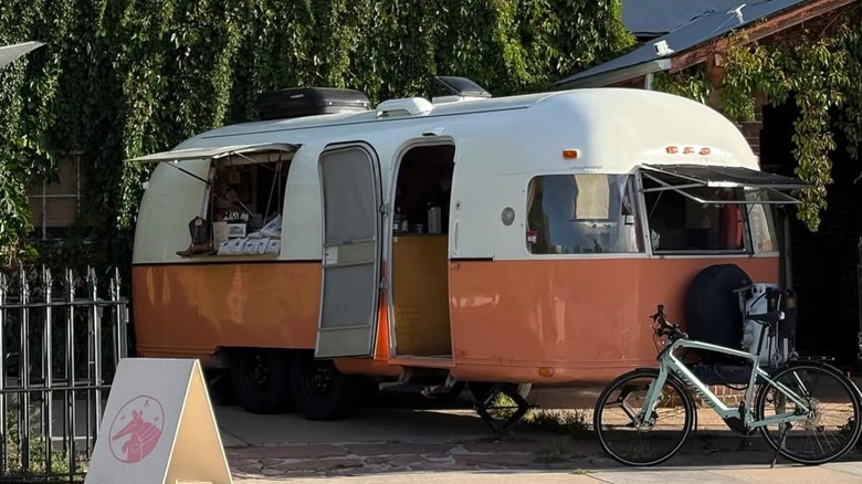 A white and pink Airstream trailor