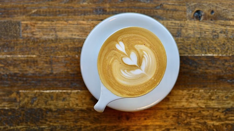 A coffee cup on a white plate