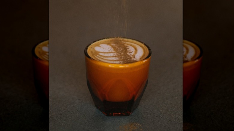 A coffee cup with foam on top