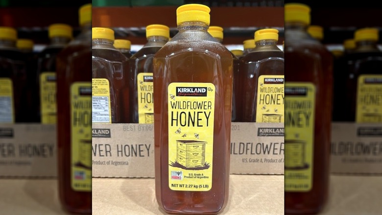Kirkland Signature wildflower honey bottle on a store shelf