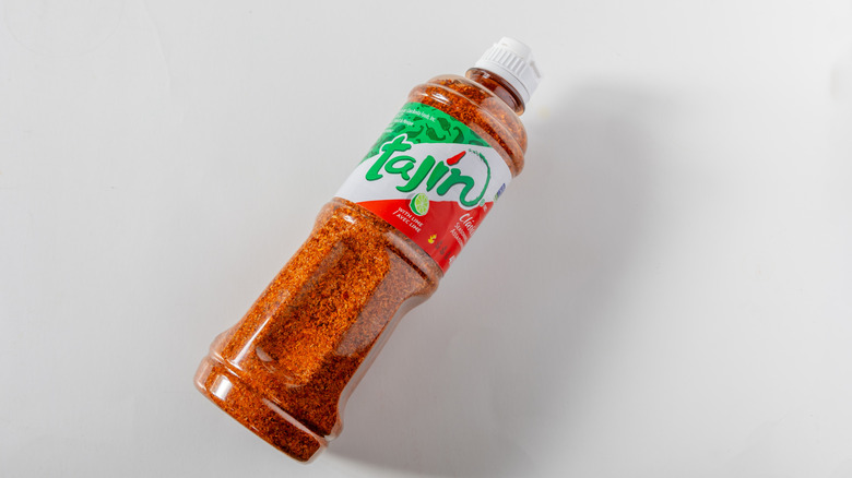 Bottle of Tajín on white surface