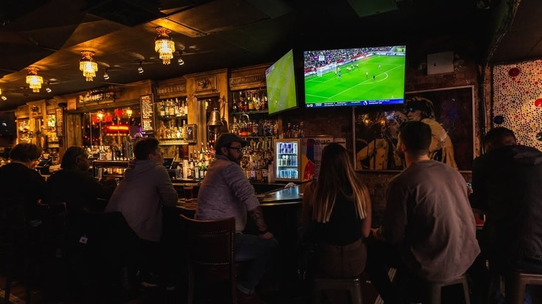 People watching a game on The Red Lion TVs