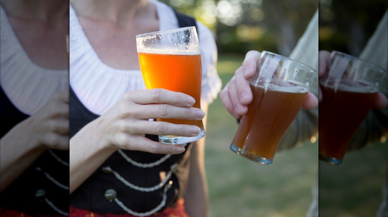 two people holding beers at McMenamins Oktoberfest