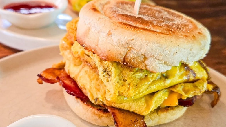 Masala egg sandwich with cheese and bacon