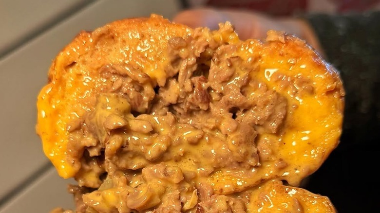Half of a Philly cheesesteak