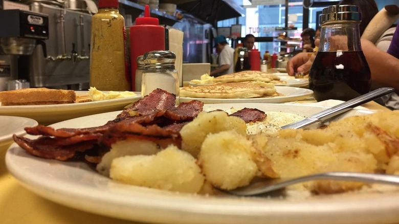 Breakfast platter with potatoes and bacon at Johny's Luncheonette
