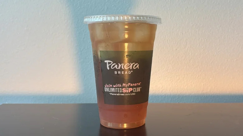 Iced tea in a plastic cup with a lid from Panera