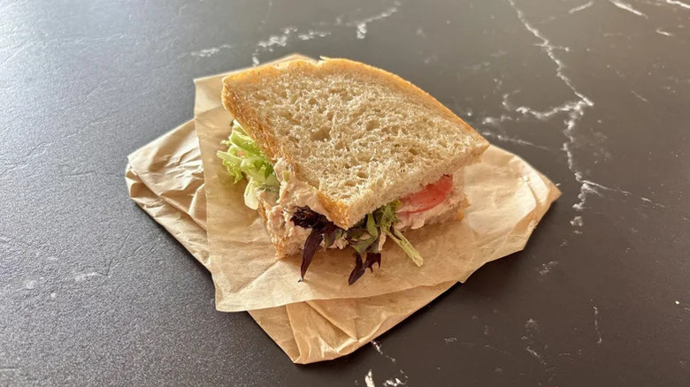 Half of Panera's Tuna salad sandwich on paper