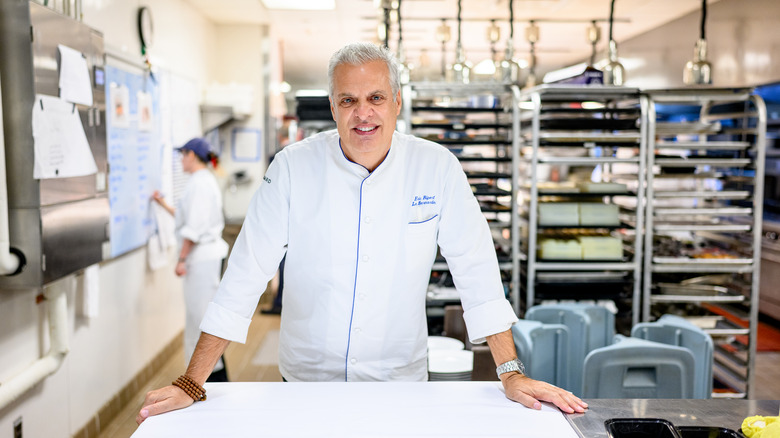 eric ripert smiling in the kitchen of le bernardin