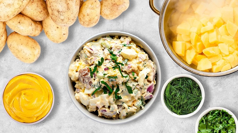 Potato salad surrounded by ingredients