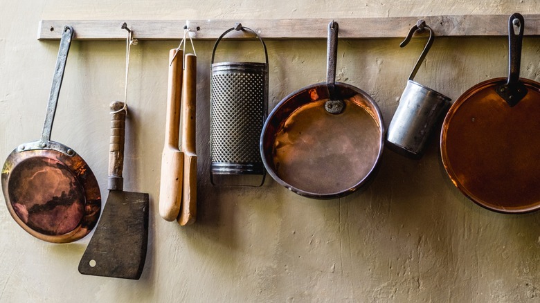 pots hanging from kitchen rack
