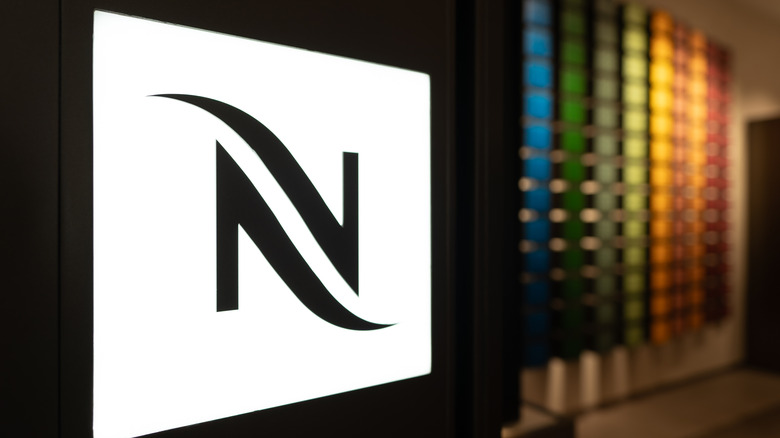 The nespresso emblem with a colored background.