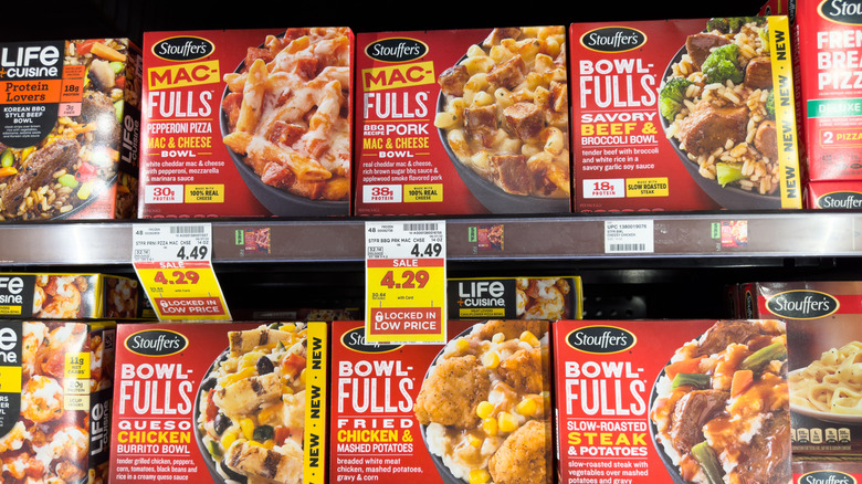 A store display of Stouffer's meals on the shelves with price tags.